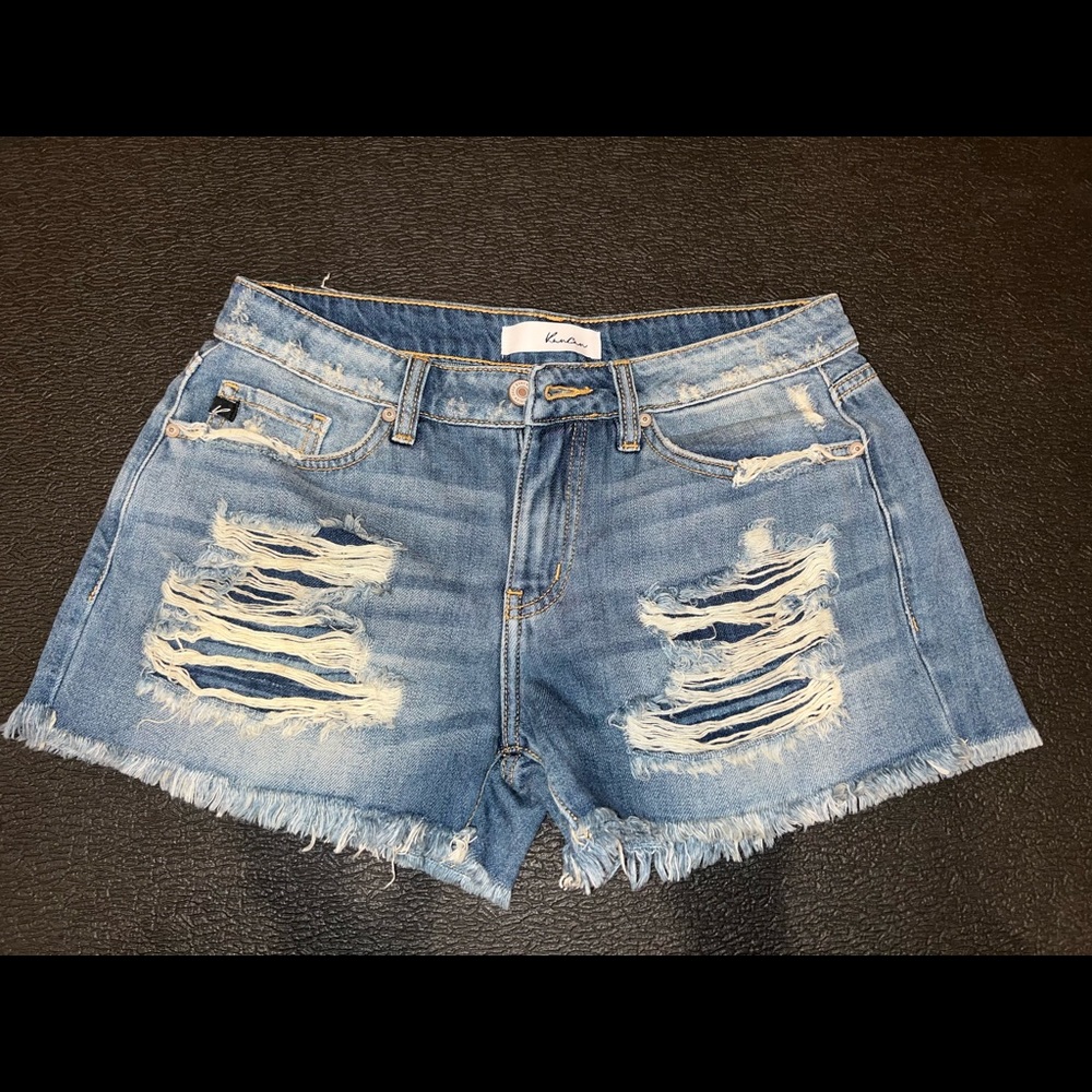 Size 27 Kancan jean shorts, 2.5-3 inch inseam, mid-high rise lots of distressing